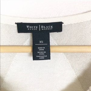 Sweater tank, lose fitting  and not heavy.